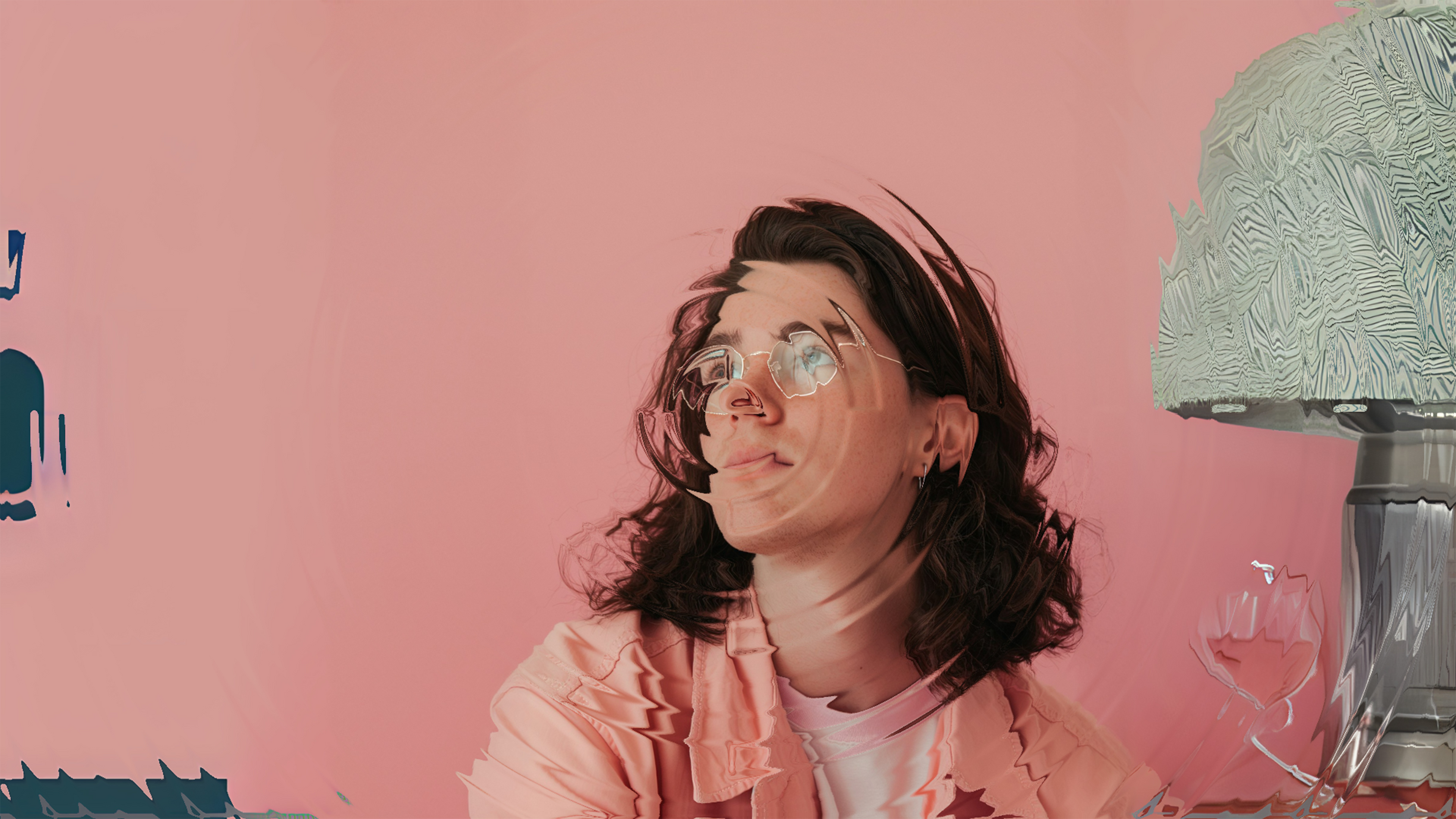 Image of a person on a pink background with a blur effect applied